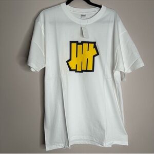 Undefeated White Graphic T-Shirt with Yellow Logo